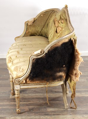 Lot 1584 - A GEORGE III PARCEL GILT AND PAINTED HEPPLEWHITE STYLE THREE SEATER SETTEE