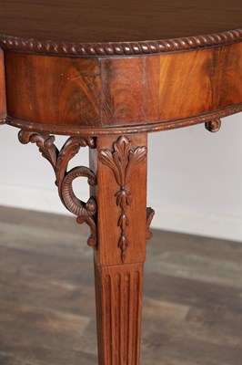 Lot 1615 - A GEORGE III FIGURED MAHOGANY SERPENTINE SERVING TABLE