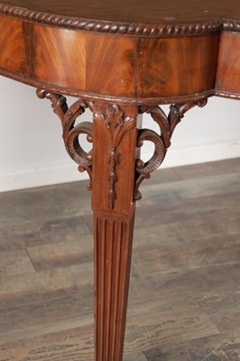 Lot 1615 - A GEORGE III FIGURED MAHOGANY SERPENTINE SERVING TABLE