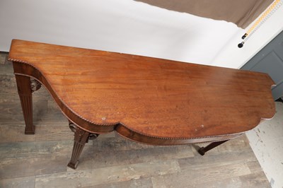 Lot 1615 - A GEORGE III FIGURED MAHOGANY SERPENTINE SERVING TABLE