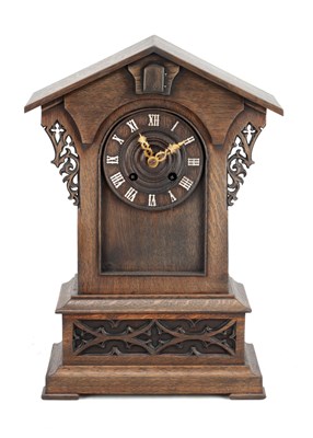 Lot 1245 - A LATE 19TH CENTURY BLACK FOREST CARVED OAK CUCKOO MANTEL CLOCK