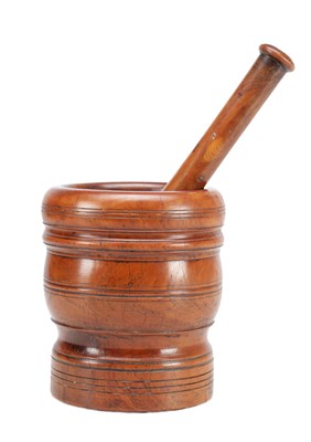 Lot 1426 - A 17TH CENTURY LIGNUM VITAE TURNED PESTLE AND MORTAR