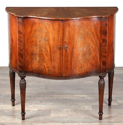 Lot 1602 - A GEORGE III MAHOGANY SERPENTINE SIDE CABINET