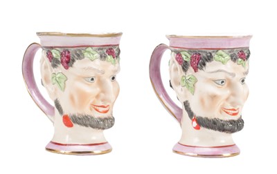 Lot 654 - TWO EARLY 19TH CENTURY ENGLISH POTTERY BACCHUS HEAD JUGS