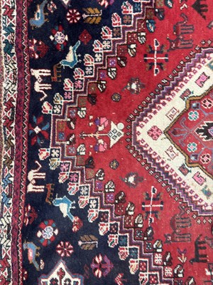 Lot 989 - A LARGE ANTIQUE PERSIAN WOOL CARPET