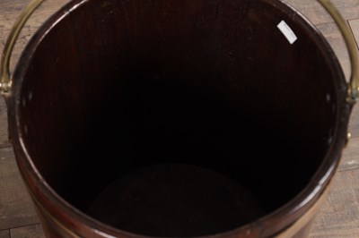 Lot 1519 - A PAIR OF GEORGE III MAHOGANY BRASS BOUND PEAT BUCKETS