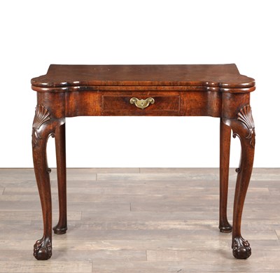 Lot 1689 - A QUEEN ANNE FIGURED WALNUT TEA TABLE