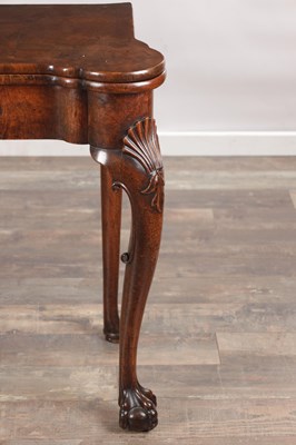 Lot 1689 - A QUEEN ANNE FIGURED WALNUT TEA TABLE