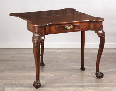Lot 1689 - A QUEEN ANNE FIGURED WALNUT TEA TABLE