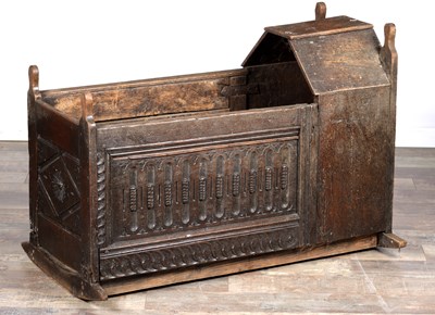 Lot 1527 - A 17TH CENTURY ENGLISH OAK HOODED ROCKING CRADLE