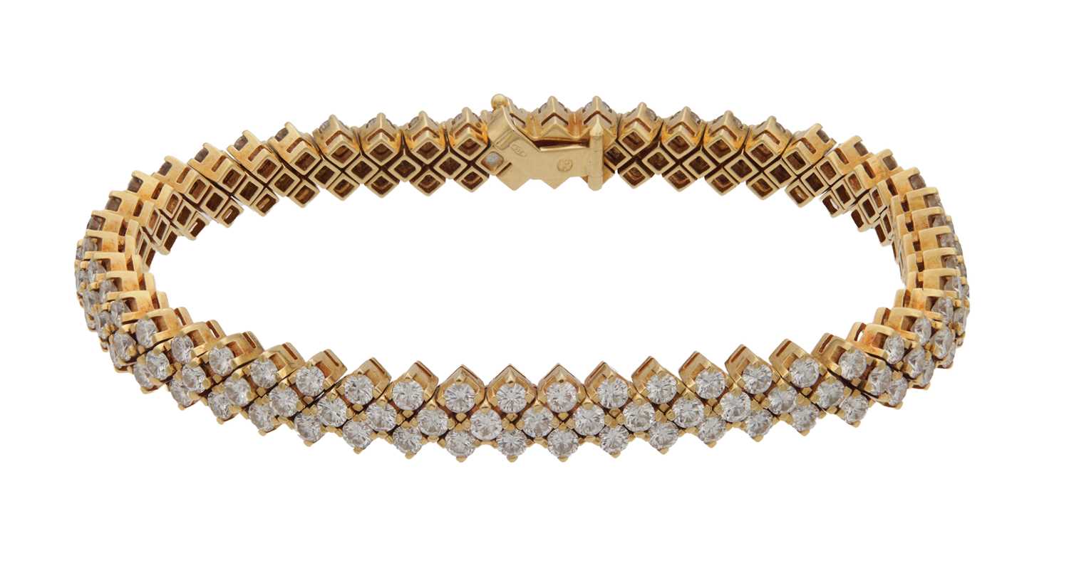 Lot 174 - AN 18CT YELLOW GOLD AND DIAMOND DOUBLE ROW BRACELET