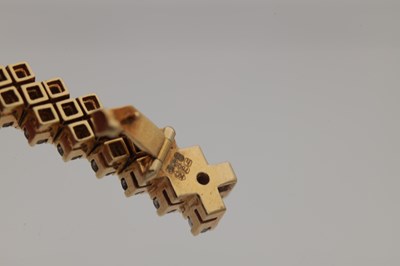 Lot 174 - AN 18CT YELLOW GOLD AND DIAMOND DOUBLE ROW BRACELET