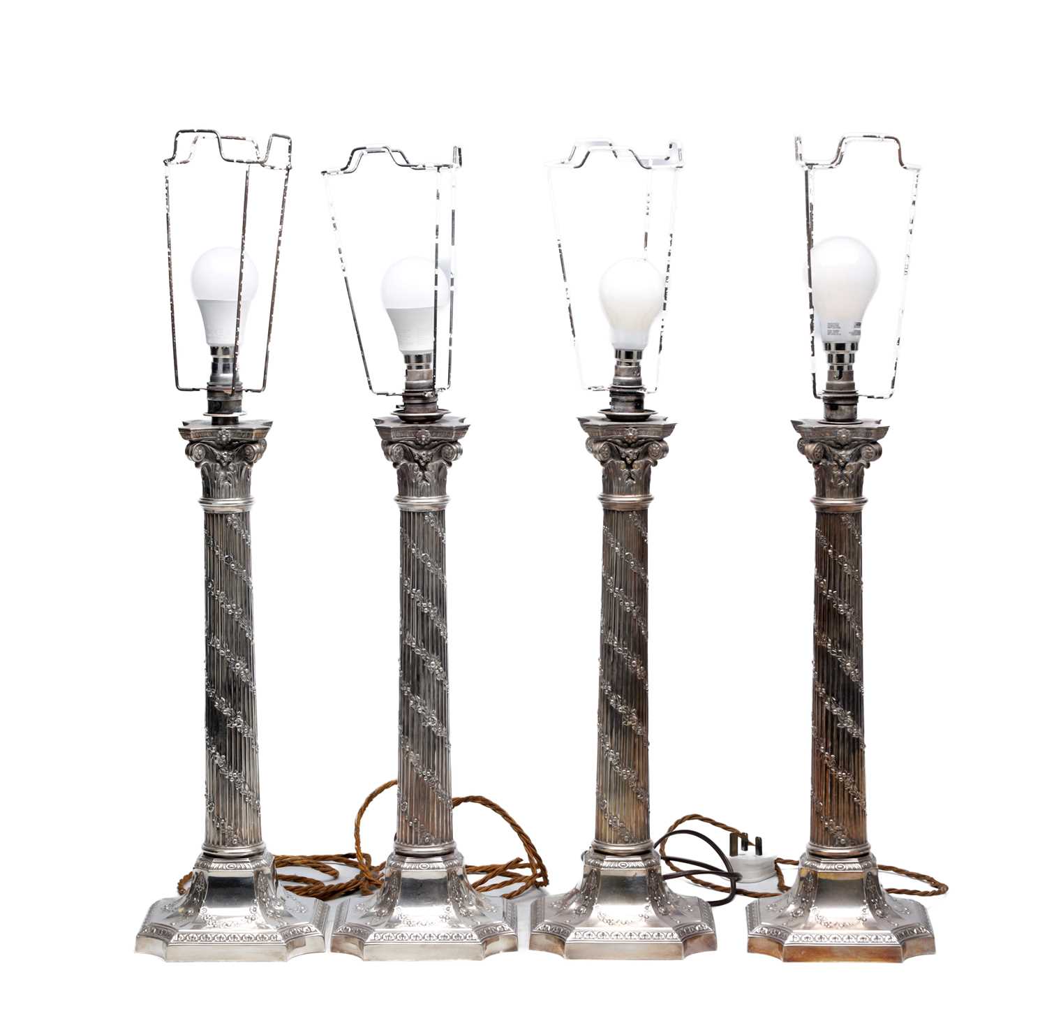 Lot 57 - A SET OF FOUR LATE 20TH CENTURY ENGLISH SILVER CORINTHIAN COLUMN TABLE LAMPS