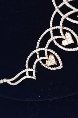 Lot 141 - AN 18CT YELLOW AND WHITE GOLD DIAMOND HEART MOTIF NECKLACE AND EARRING SET
