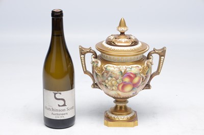 Lot 622 - H AYRTON A ROYAL WORCESTER PORCELAIN FRUIT PAINTED TWO HANDLED PEDESTAL VASE AND COVER