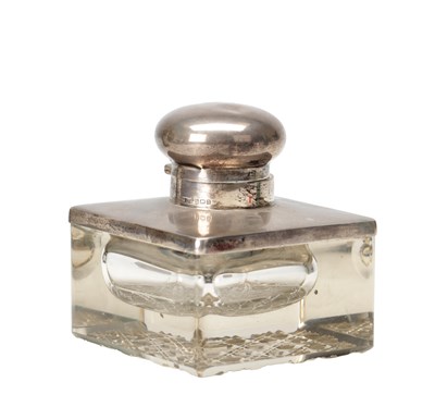 Lot 17 - A 1912 ENGLISH SILVER MOUNTED CUT GLASS INKWELL