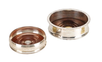 Lot 119 - A COLLECTION OF THREE ENGLISH SILVER AND MAHOGANY BOTTLE COASTERS