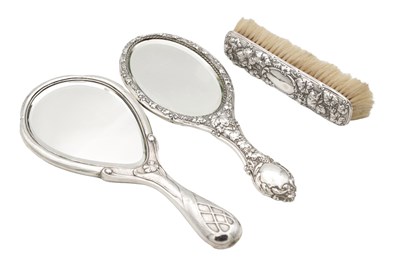 Lot 129 - TWO EDWARDIAN ENGLISH SILVER HAND MIRRORS AND A CLOTHES BRUSH