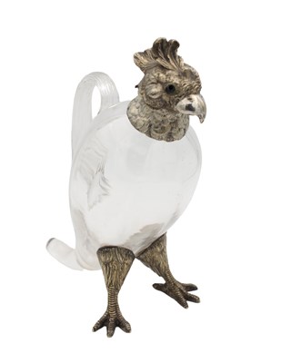 Lot 136 - A SILVER MOUNTED GLASS DECANTER JUG IN THE FORM OF A COCKATOO