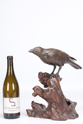 Lot 819 - A MEIJI PERIOD JAPANESE BRONZE MODEL OF A CROW ON A CARVED ROOT WOOD STAND