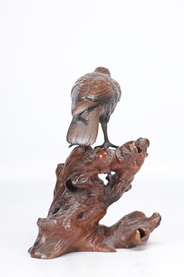 Lot 819 - A MEIJI PERIOD JAPANESE BRONZE MODEL OF A CROW ON A CARVED ROOT WOOD STAND