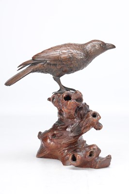Lot 819 - A MEIJI PERIOD JAPANESE BRONZE MODEL OF A CROW ON A CARVED ROOT WOOD STAND