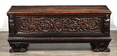 Lot 1562 - A 17TH CENTURY ITALIAN CARVED WALNUT CASSONE