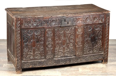 Lot 1656 - AN EARLY 17TH CENTURY CARVED OAK COFFER