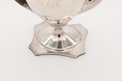 Lot 22 - A GEORGE III ENGLISH PROVINCIAL SILVER COFFEE POT BY HAMPSTON, PRINCE & CATTLES, YORK