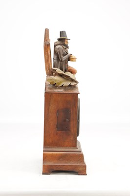 Lot 1321 - A RARE 19TH CENTURY BLACK FOREST FIGURED WALNUT AUTOMATON "DUMPLING EATER" MANTEL CLOCK