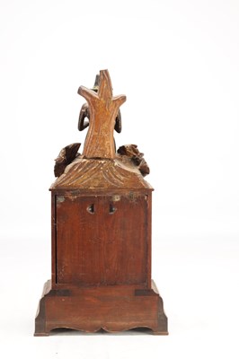 Lot 1321 - A RARE 19TH CENTURY BLACK FOREST FIGURED WALNUT AUTOMATON "DUMPLING EATER" MANTEL CLOCK