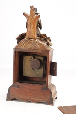 Lot 1321 - A RARE 19TH CENTURY BLACK FOREST FIGURED WALNUT AUTOMATON "DUMPLING EATER" MANTEL CLOCK