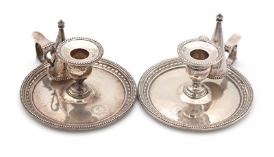 Lot 67 - A PAIR OF VICTORIAN ENGLISH SILVER CHAMBERSTICKS WITH CONICAL SNUFFERS