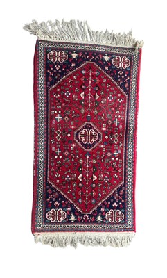 Lot 1018 - A HAND-KNOTTED PERSIAN WOOL RUG