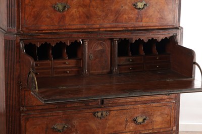 Lot 1688 - A GOOD EARLY 18TH CENTURY FIGURED WALNUT SECRETAIRE CHEST ON CHEST WITH STARBURST INLAID BASE