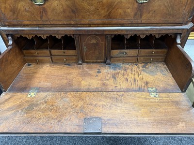 Lot 1688 - A GOOD EARLY 18TH CENTURY FIGURED WALNUT SECRETAIRE CHEST ON CHEST WITH STARBURST INLAID BASE