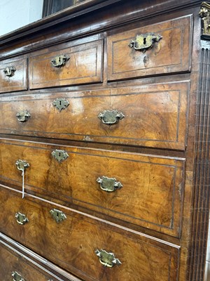 Lot 1688 - A GOOD EARLY 18TH CENTURY FIGURED WALNUT SECRETAIRE CHEST ON CHEST WITH STARBURST INLAID BASE