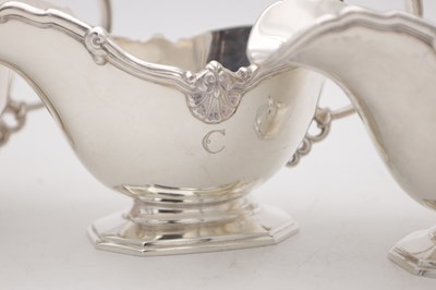 Lot 18 - A SET OF FOUR MID 20TH CENTURY ENGLISH SILVER SAUCE BOATS BY MAPPIN AND WEBB