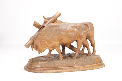 Lot 1400 - ATT JOHANN HUGLER A SWISS BLACK FOREST CARVED WOOD GROUP OF YOKED OXEN ON OVAL BASE
