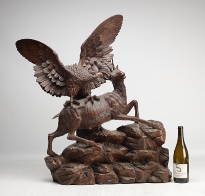 Lot 1391 - A LARGE AND IMPRESSIVE BLACK FOREST CARVED WOOD GROUP OF AN EAGLE ATTACKING A CHAMOIS