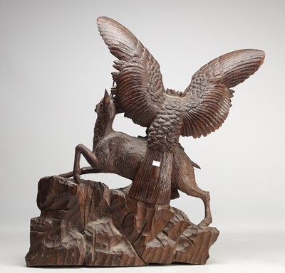 Lot 1391 - A LARGE AND IMPRESSIVE BLACK FOREST CARVED WOOD GROUP OF AN EAGLE ATTACKING A CHAMOIS
