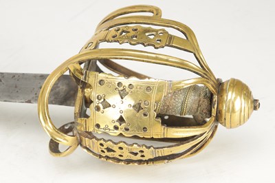 Lot 842 - AN 18TH CENTURY SCOTTISH BRASS HILTED BASKET-HILT SWORD