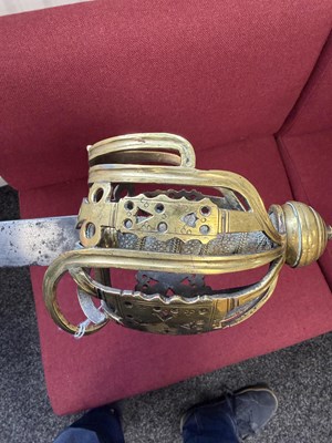 Lot 842 - AN 18TH CENTURY SCOTTISH BRASS HILTED BASKET-HILT SWORD