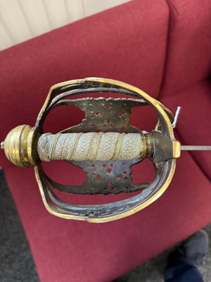 Lot 842 - AN 18TH CENTURY SCOTTISH BRASS HILTED BASKET-HILT SWORD