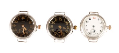 Lot 370 - THREE EARLY 20TH CENTURY ENGLISH SILVER CASED TRENCH WATCHES, TWO BY LONGINES