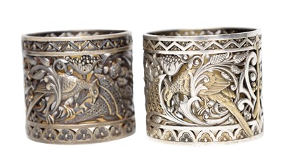 Lot 126 - A LARGE PAIR OF PIERCED SILVER AND SILVER GILT NAPKIN RINGS